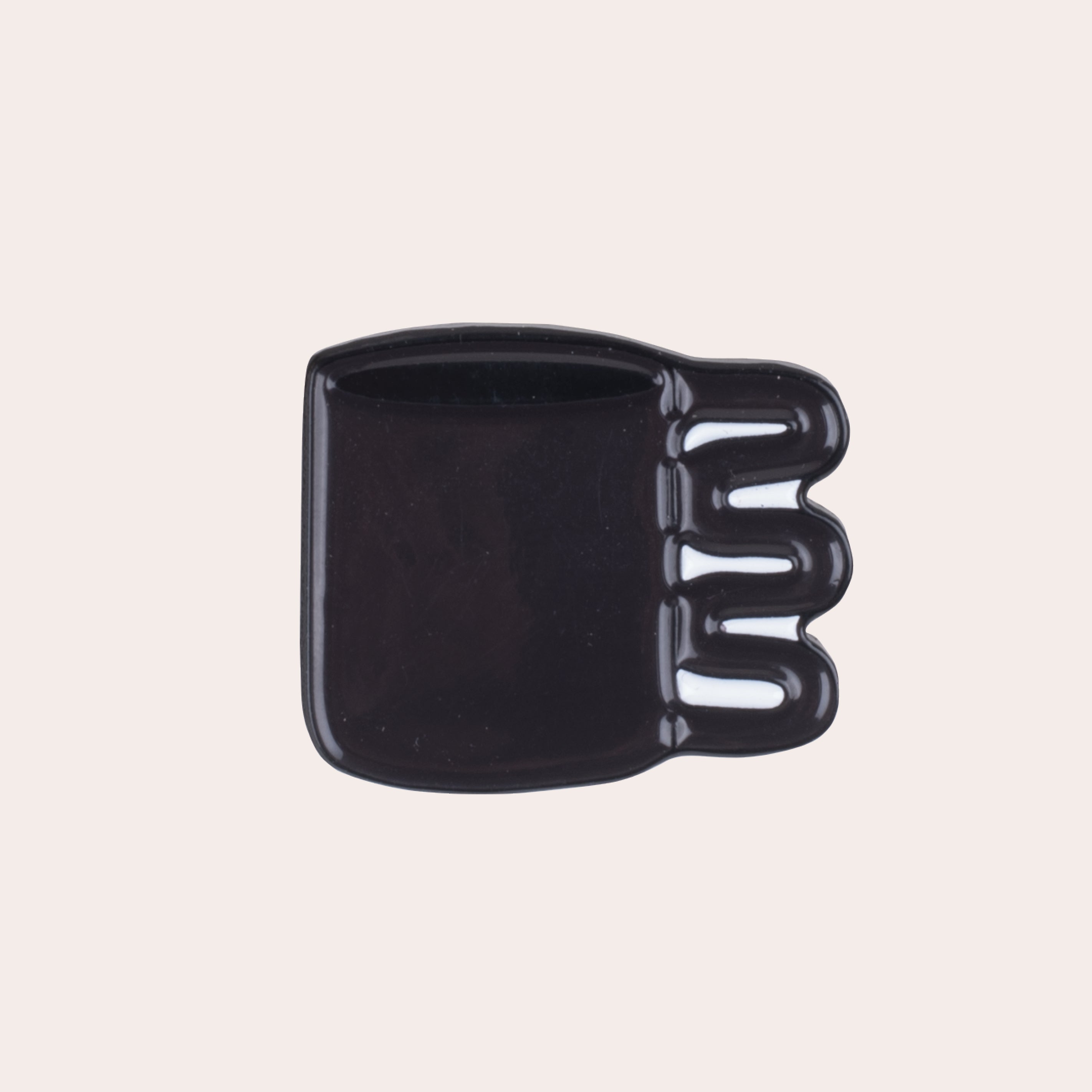 A soft enamel squiggle mug pin with PVC rubber back.