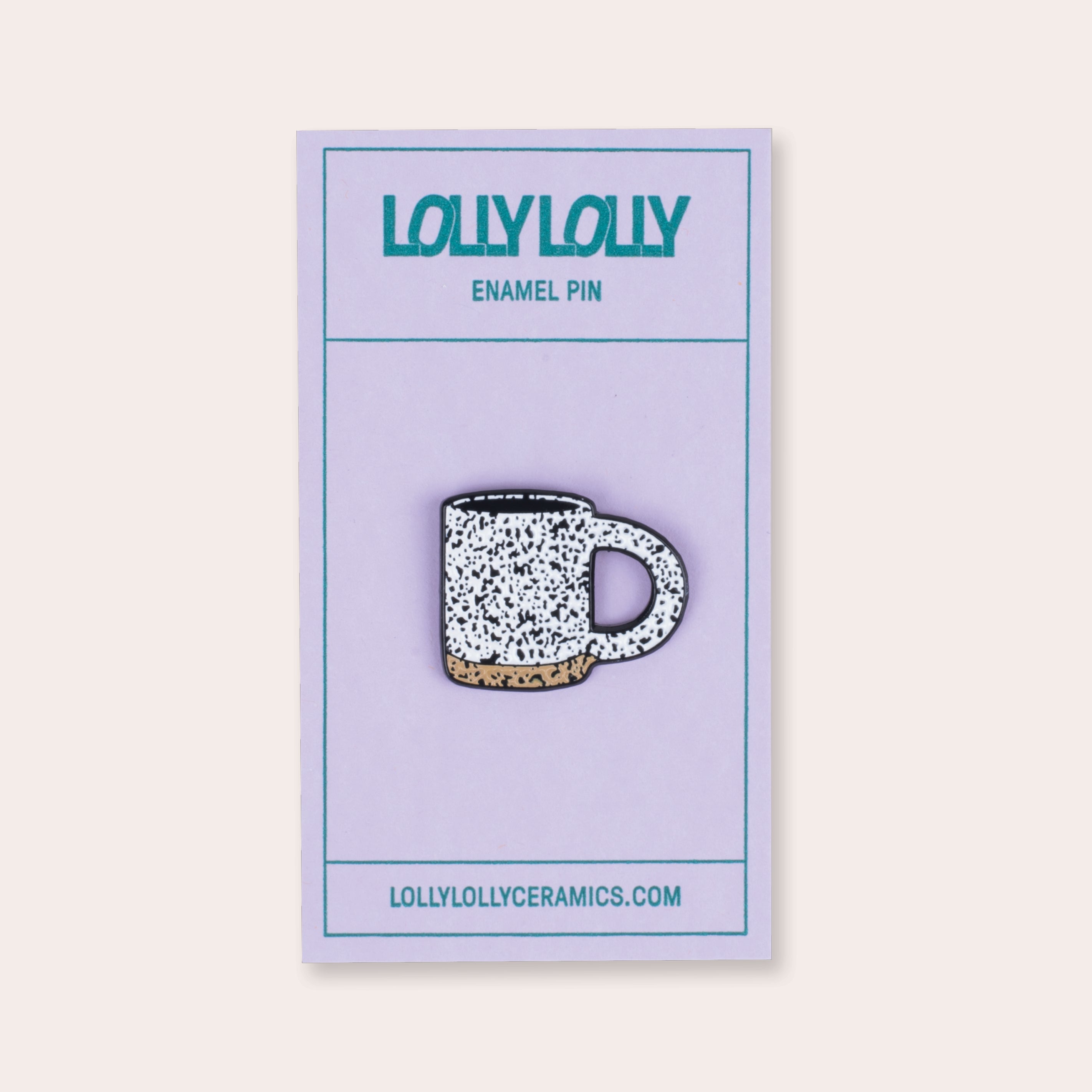 A soft enamel speckled mug pin with PVC rubber back.