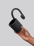 Black matte stoneware ceramic mug with a curved hook and circular detail  handle.
