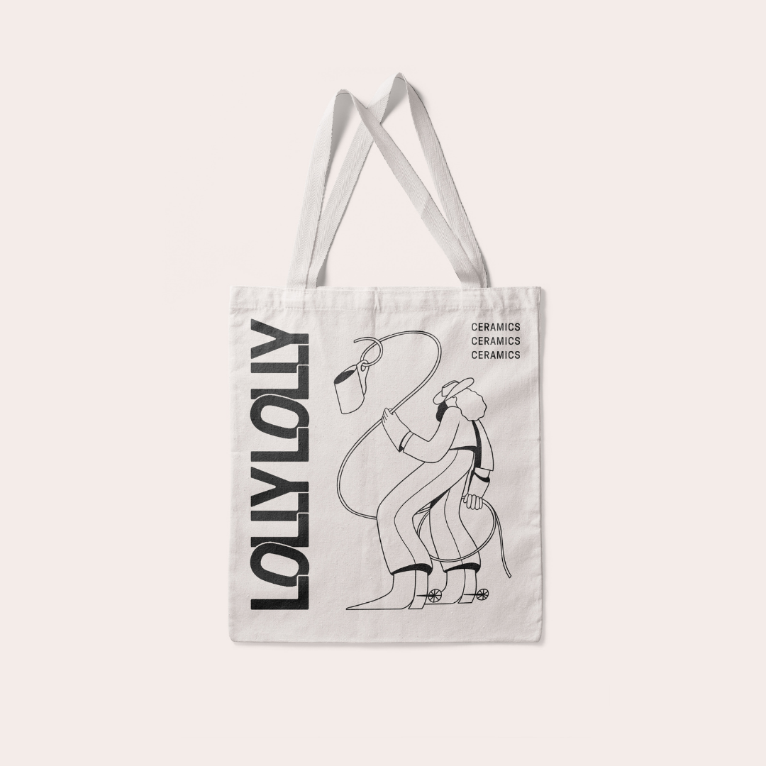 Cowgirl Lolly Tote Bag with the word &quot;ceramics&quot; printed three times in the top right corner of the bag. 