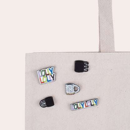 A soft enamel pin that reads &quot;Lolly Lolly&quot; in colorful letters with PVC rubber back.