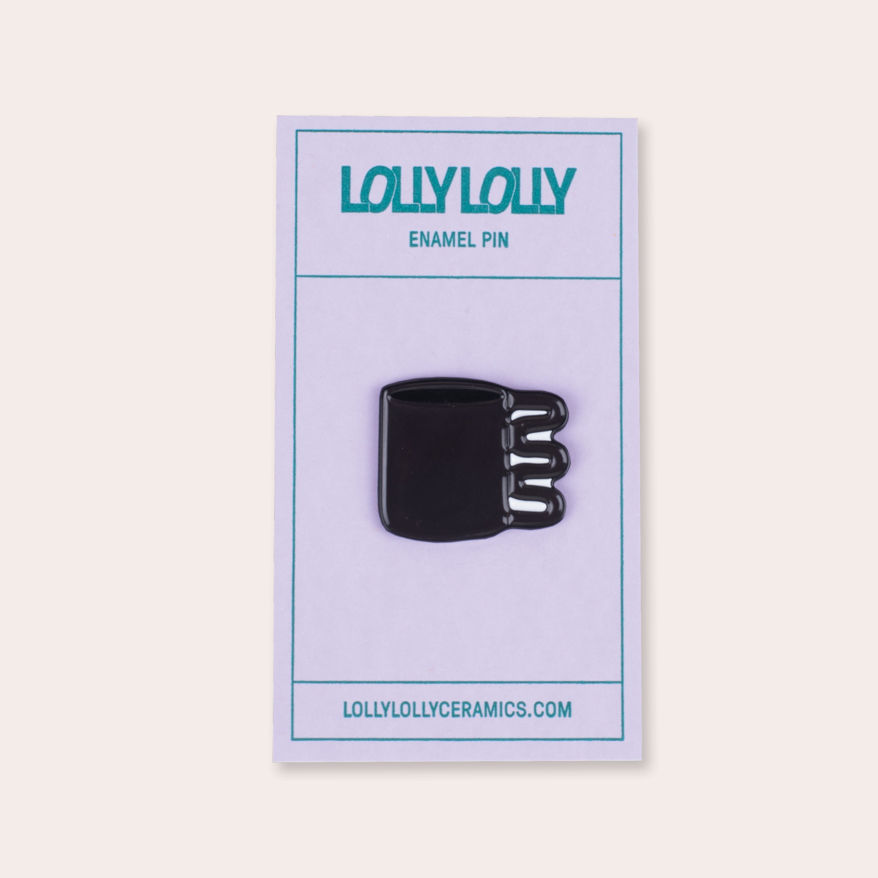 A soft enamel squiggle mug pin with PVC rubber back.