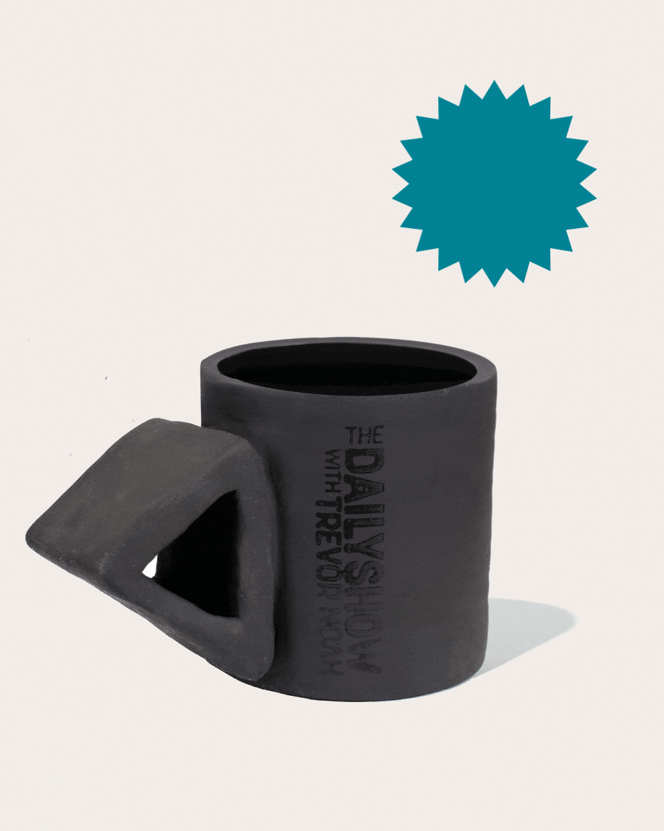 Black matte stoneware ceramic mug with an extended triangle shaped handle.