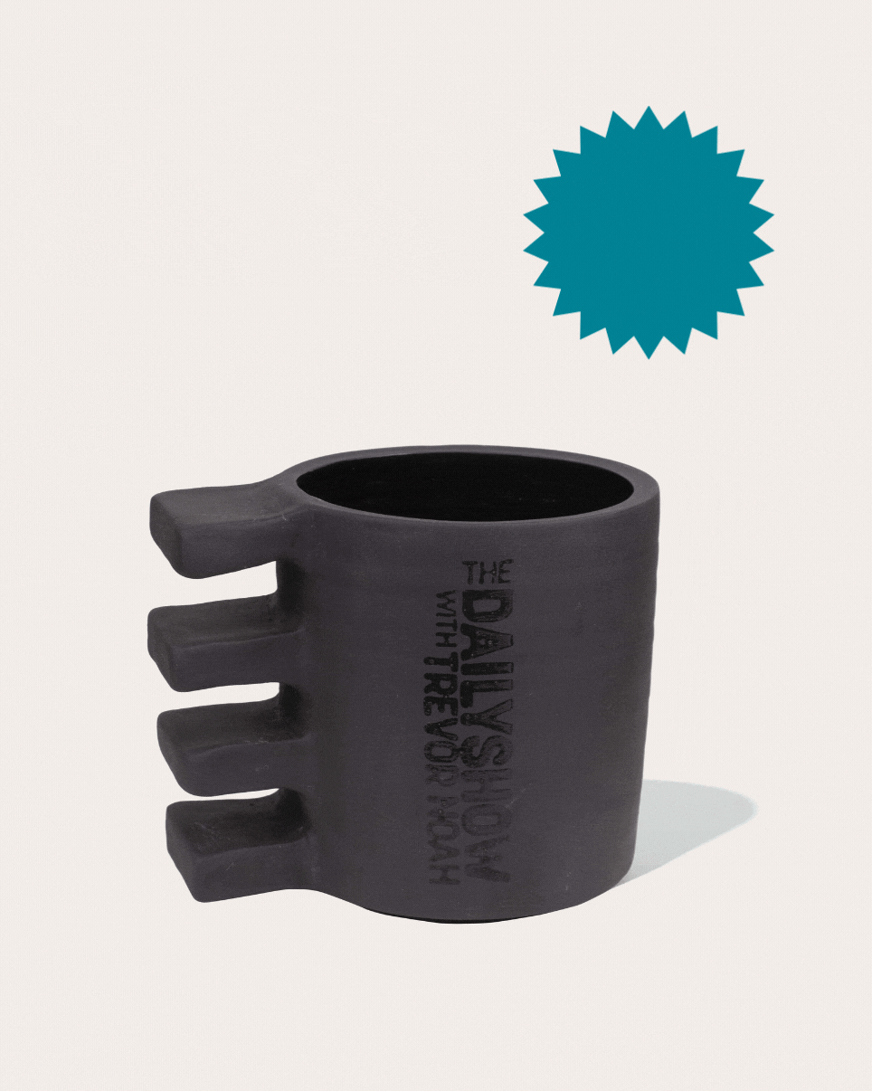Black matte stoneware ceramic mug with four thick rectangles on the side as the handle.