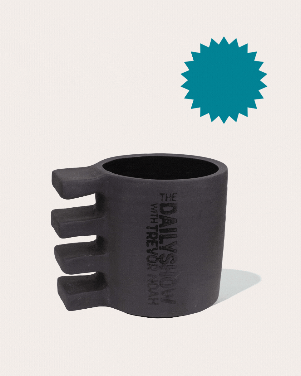 Black matte stoneware ceramic mug with four thick rectangles on the side as the handle. 