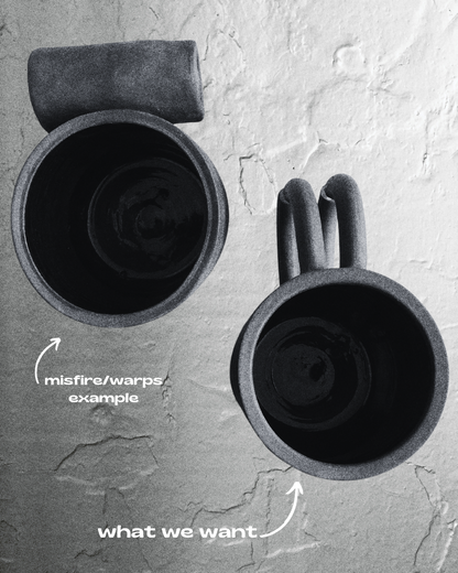 Black matte stoneware ceramic mug with a full side roll as the handle.
