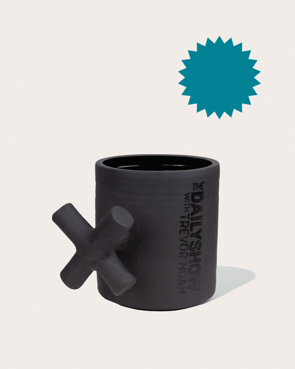 Black matte stoneware ceramic mug with an extended x-shape as the handle.